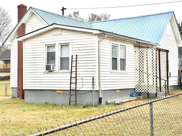 view of property exterior featuring cooling unit and a yard