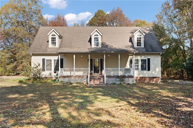 view of front of property featuring a porch, crawl space, and a front yard