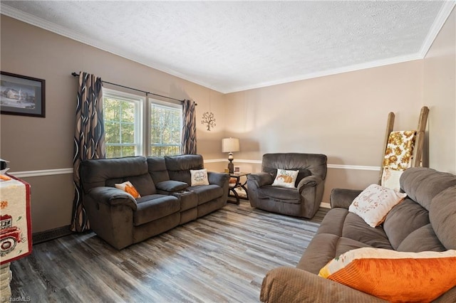 living area with crown molding, baseboards, a textured ceiling, and wood finished floors