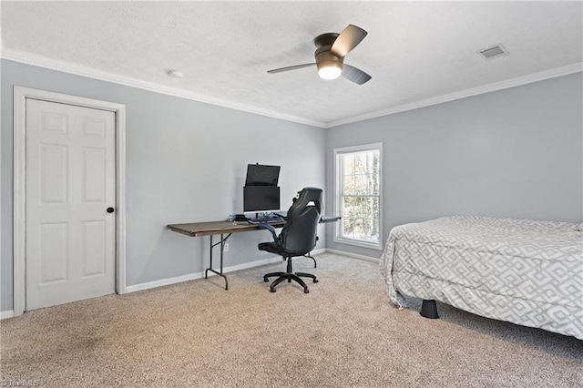 bedroom featuring crown molding, baseboards, and carpet