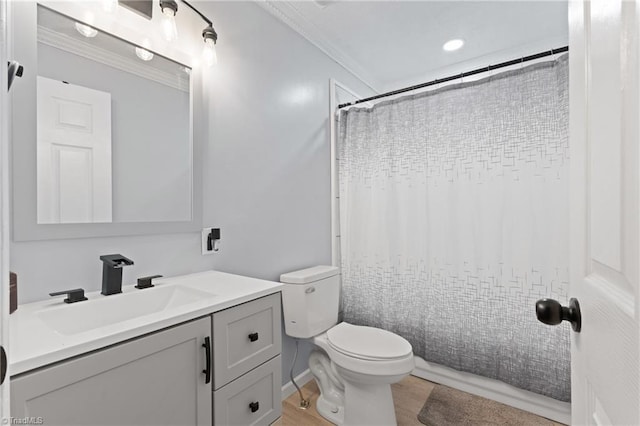 full bathroom featuring vanity, ornamental molding, a shower with shower curtain, and toilet