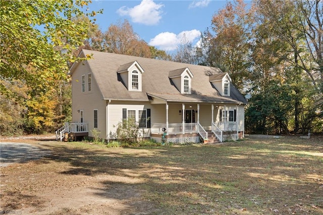 cape cod-style house featuring covered porch