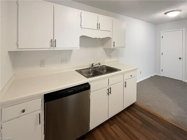 kitchen with stainless steel dishwasher, sink, dark wood-type flooring, and white cabinetry