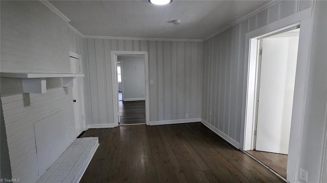 interior space featuring crown molding and dark hardwood / wood-style floors