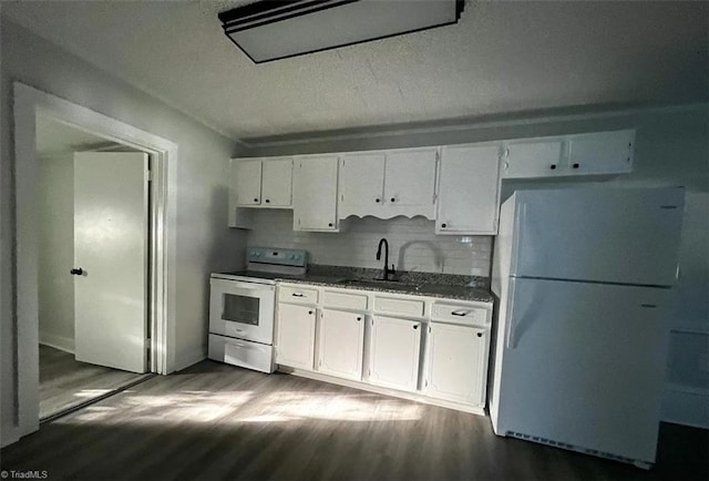 kitchen featuring white appliances, white cabinetry, sink, and dark hardwood / wood-style flooring