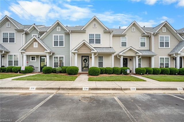 3719 Spanish Peak Dr, High Point, NC 27265 - view of property with uncovered parking and a front yard
