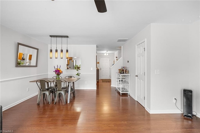 3719 Spanish Peak Dr, High Point, NC 27265 - dining area with wood finished floors, ceiling fan, baseboards, and stairs