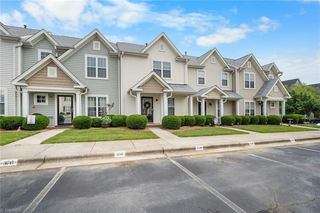 3719 Spanish Peak Dr, High Point, NC 27265 - view of property with uncovered parking and a front yard