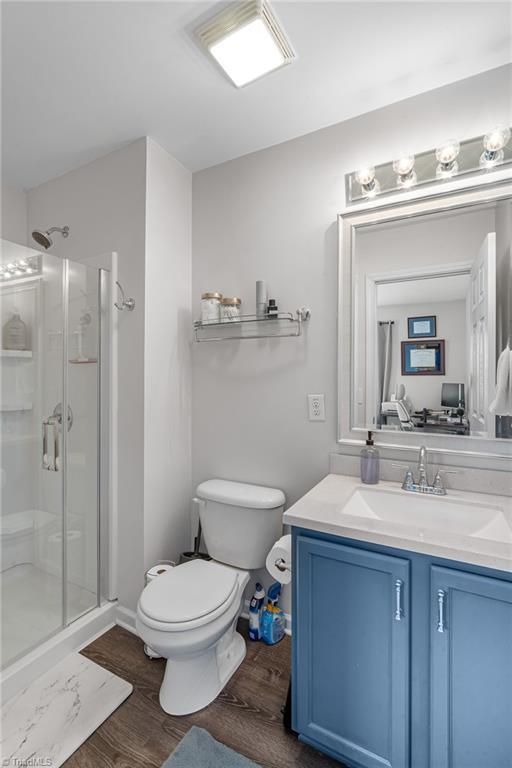 3719 Spanish Peak Dr, High Point, NC 27265 - full bath featuring toilet, a shower stall, and vanity