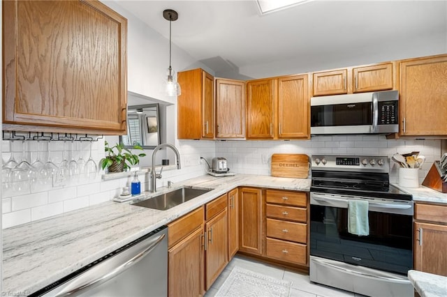 3719 Spanish Peak Dr, High Point, NC 27265 - kitchen featuring stainless steel appliances, a sink, backsplash, and light stone counters