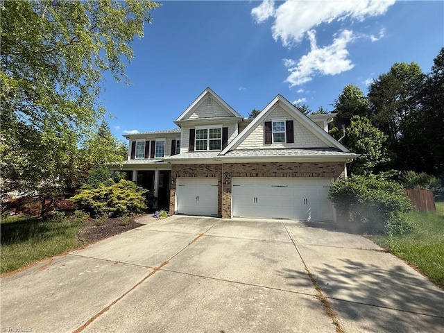 view of front of property with driveway and a garage