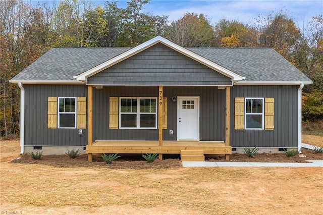 view of front of property featuring covered porch