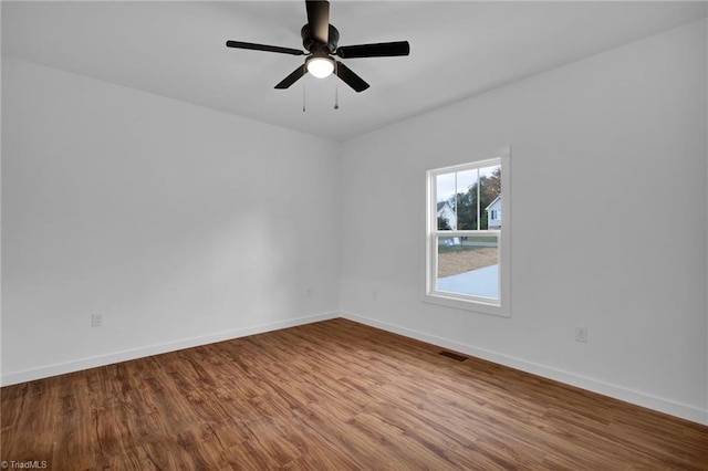 unfurnished room featuring hardwood / wood-style flooring and ceiling fan