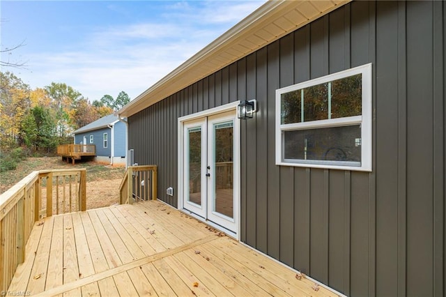 wooden deck featuring french doors