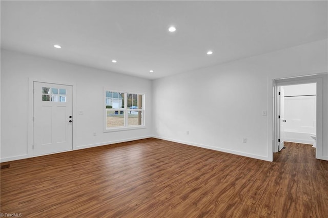 unfurnished living room featuring dark hardwood / wood-style flooring