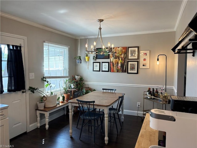 dining space with a chandelier, crown molding, dark wood-style flooring, and baseboards