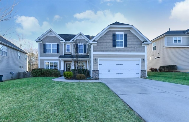 view of front of house with a garage and a front lawn