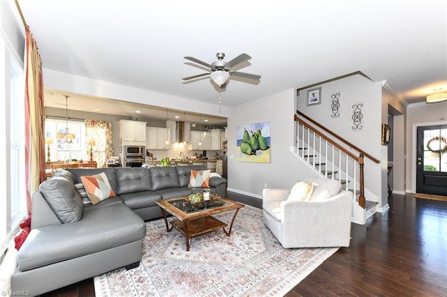 living room featuring crown molding, hardwood / wood-style flooring, and ceiling fan