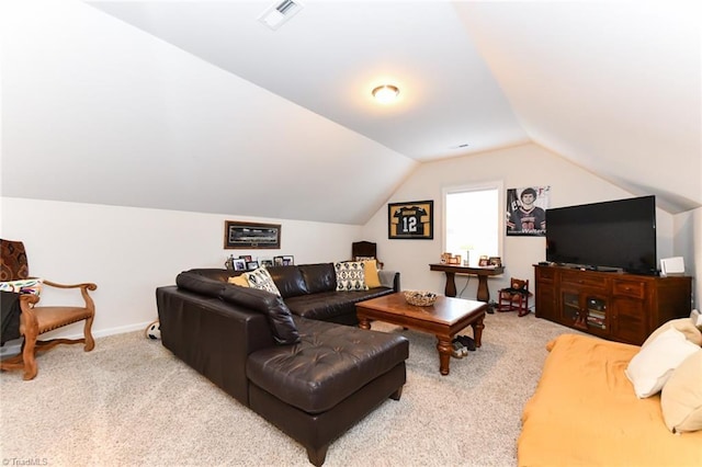 carpeted living room with vaulted ceiling