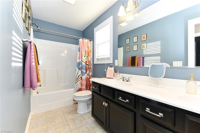 full bathroom with tile patterned floors, toilet, shower / bath combo with shower curtain, and vanity