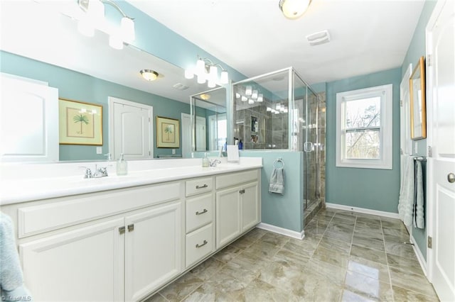 bathroom with vanity and a shower with shower door