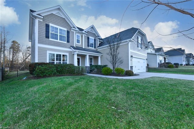 view of front of property with a garage and a front lawn