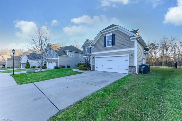 view of front of house with a garage and a front lawn