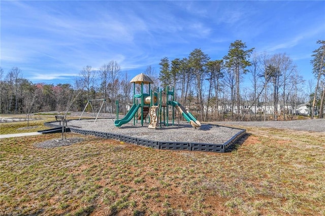 view of jungle gym featuring a lawn