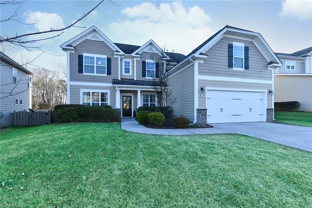 view of front of house featuring a garage and a front yard