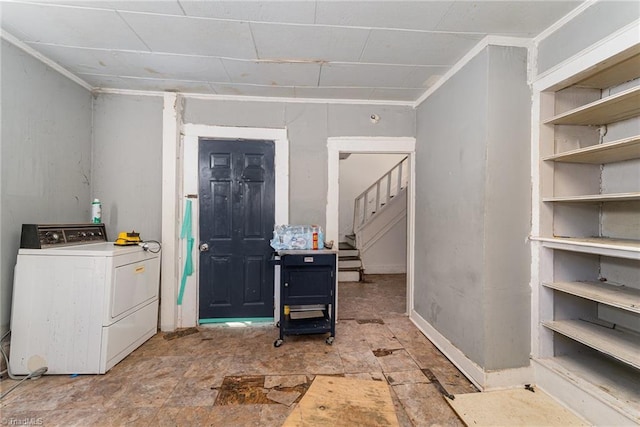 washroom with washer / clothes dryer and ornamental molding