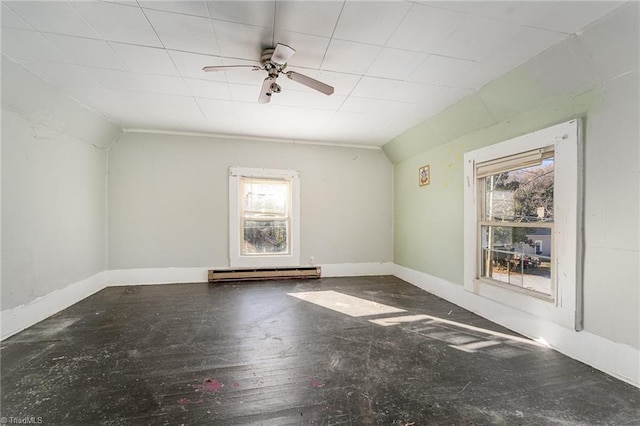 empty room featuring wood-type flooring, a baseboard radiator, ceiling fan, and lofted ceiling