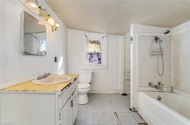 full bathroom with vanity, toilet, tiled shower / bath, and lofted ceiling