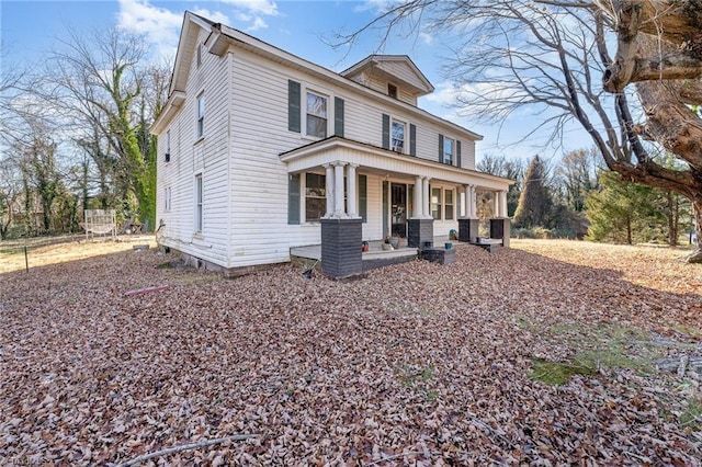 view of front of house featuring covered porch and cooling unit