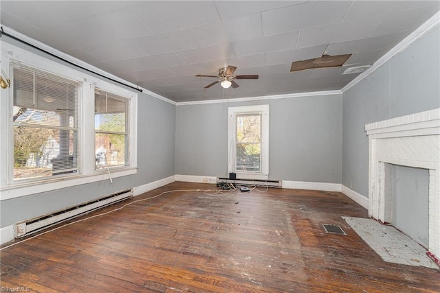 unfurnished living room with dark hardwood / wood-style floors, a wealth of natural light, and a baseboard radiator