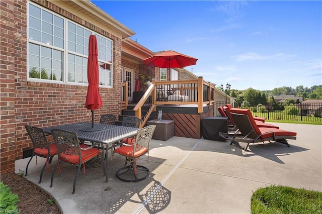 view of patio / terrace featuring fence and outdoor dining area