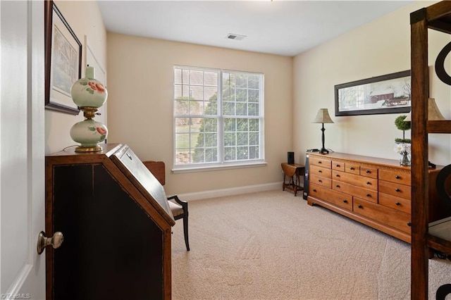 living area with carpet flooring and baseboards