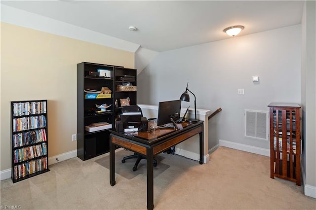 office featuring light carpet and baseboards