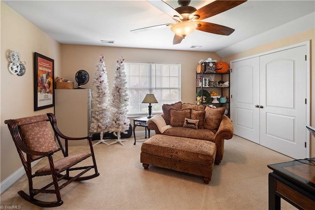 sitting room featuring ceiling fan and light carpet