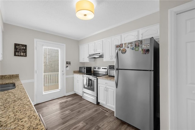 kitchen featuring dark hardwood / wood-style flooring, light stone countertops, white cabinets, and appliances with stainless steel finishes