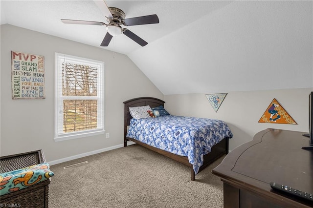 bedroom with vaulted ceiling, ceiling fan, and carpet flooring