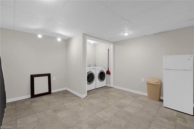 laundry area with track lighting and separate washer and dryer