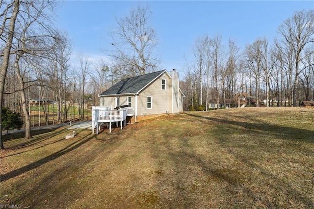 exterior space with a yard and a deck