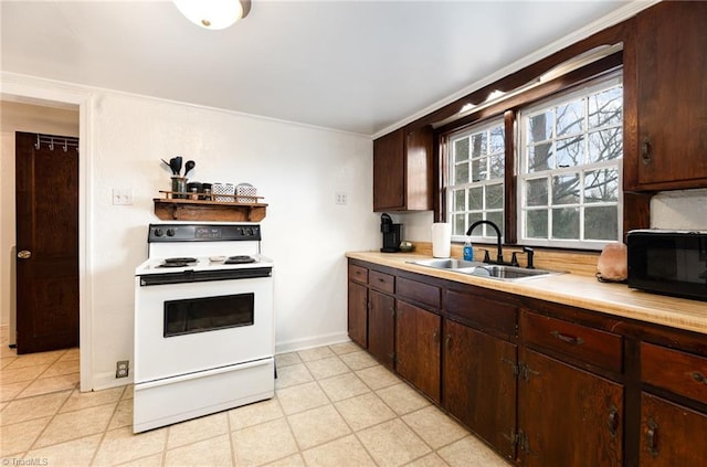 kitchen featuring black microwave, a sink, light countertops, dark brown cabinets, and white range with electric stovetop