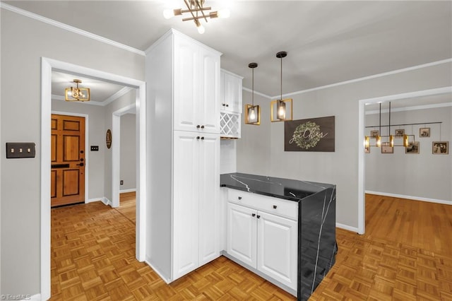 1508 Lafayette Ct, Greensboro, NC 27408 - kitchen with a chandelier, baseboards, dark countertops, white cabinets, and ornamental molding