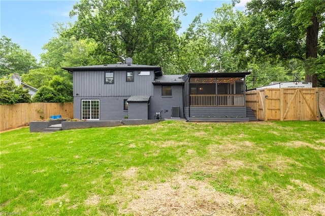 1508 Lafayette Ct, Greensboro, NC 27408 - back of property with central AC unit, a gate, a sunroom, brick siding, and a chimney