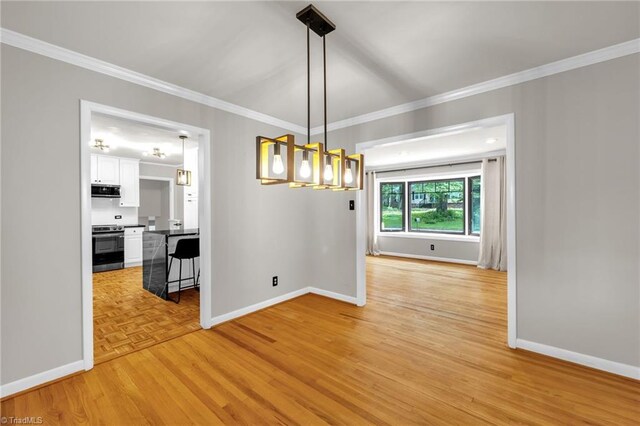 1508 Lafayette Ct, Greensboro, NC 27408 - unfurnished dining area featuring baseboards, crown molding, light wood-style floors, and a chandelier