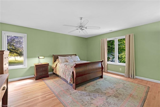 1134 Edwards Farm Rd, King, NC 27021 - bedroom with baseboards, light wood-style floors, and ceiling fan