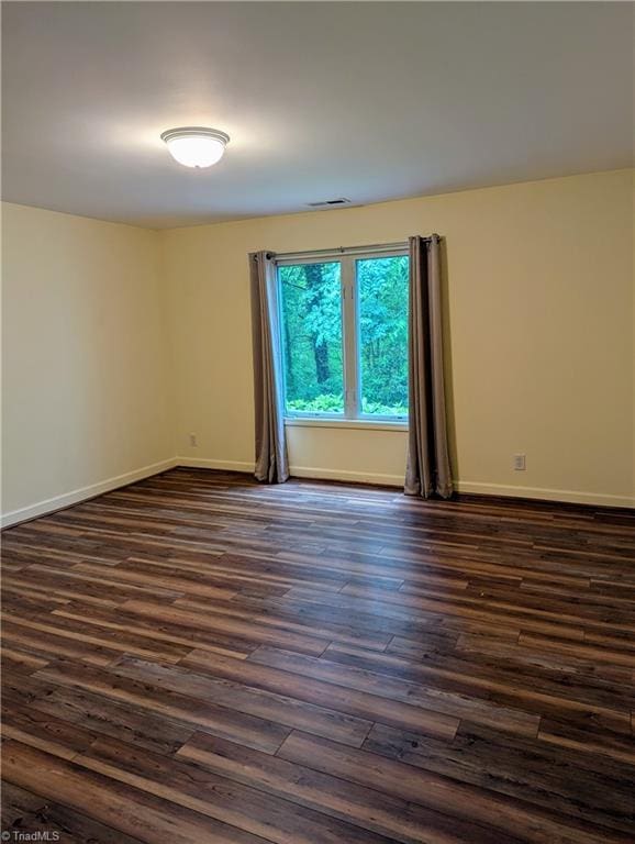 1134 Edwards Farm Rd, King, NC 27021 - spare room featuring dark wood-type flooring and baseboards