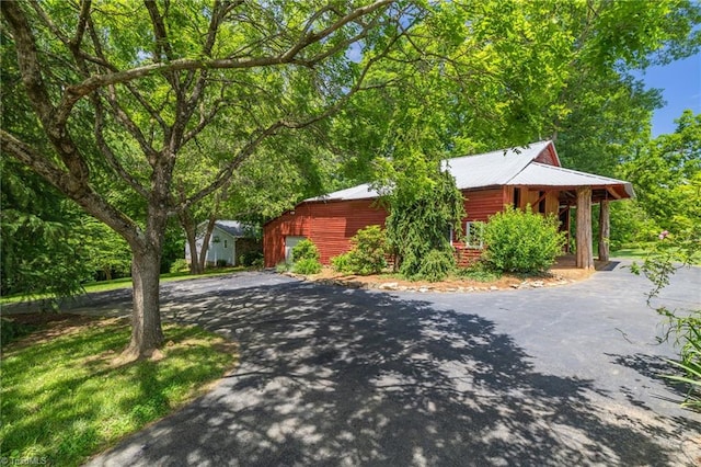 1134 Edwards Farm Rd, King, NC 27021 - view of front of house featuring driveway, metal roof, and a porch