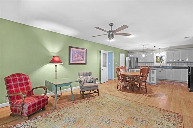 1134 Edwards Farm Rd, King, NC 27021 - living area featuring light wood-style flooring, baseboards, and ceiling fan